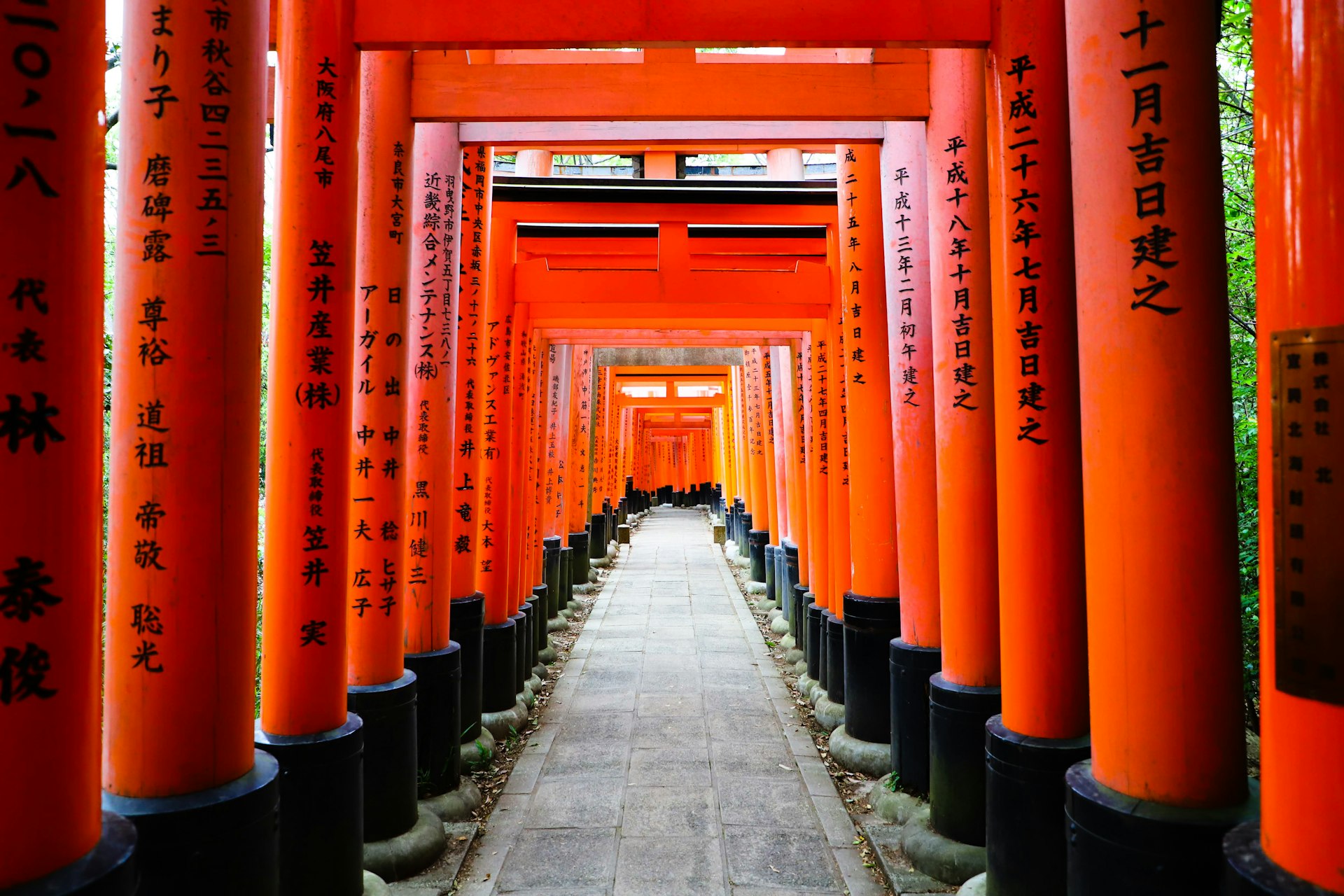 Red torii and shrine lanterns in Kyoto, Japan